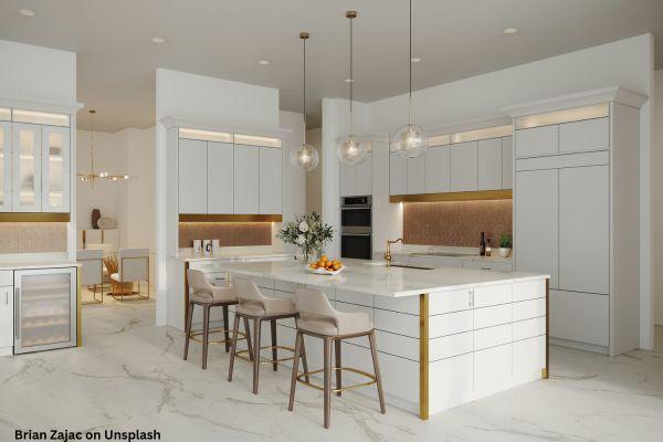 white and gold kitchen with ball pendant light
