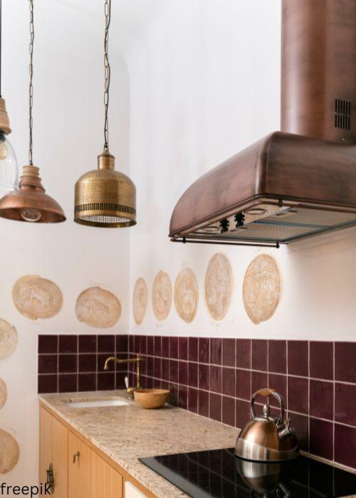 copper and gold cookware and range hood