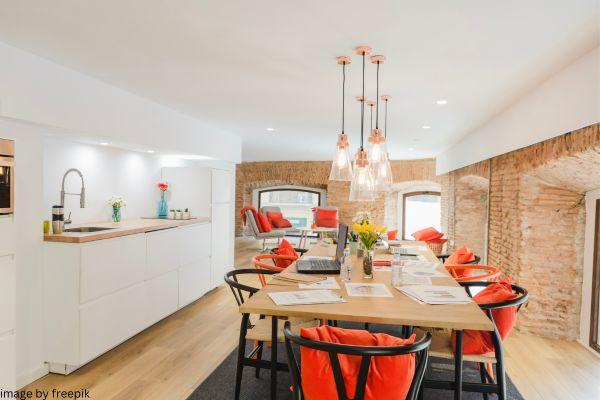 black chairs and orange cushions is best combo in kitchen