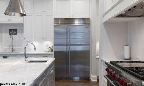 white and silver kitchen with red accent