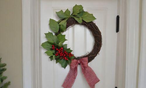 white pantry door with red berries wreath