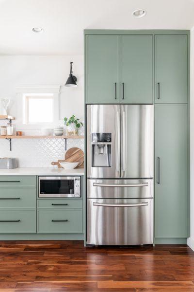 Green Cabinets with Stainless Steel Accents