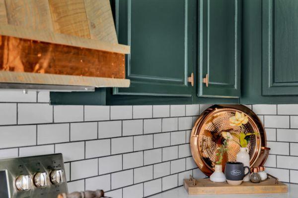 Green Cabinets with Copper Accents