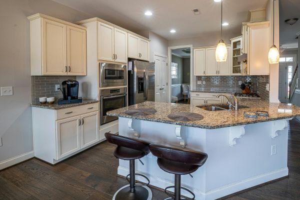 White Cabinets with Dark Flooring